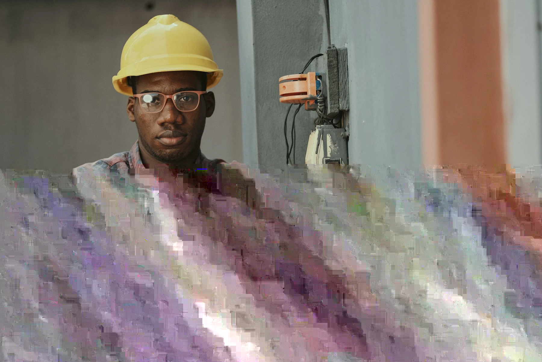An engineer working on a wall